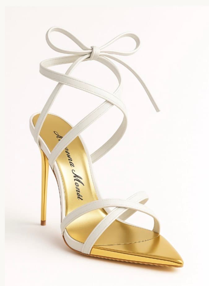 The Luxe Heart Stiletto in Blanco ivory white with a gold mirror cap toe